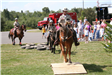 Three mounted officers performing an obstacle course