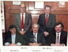 Group photograph of five commissioners on 1980s and 1990s