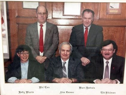Group photograph of five commissioners on 1980s and 1990s